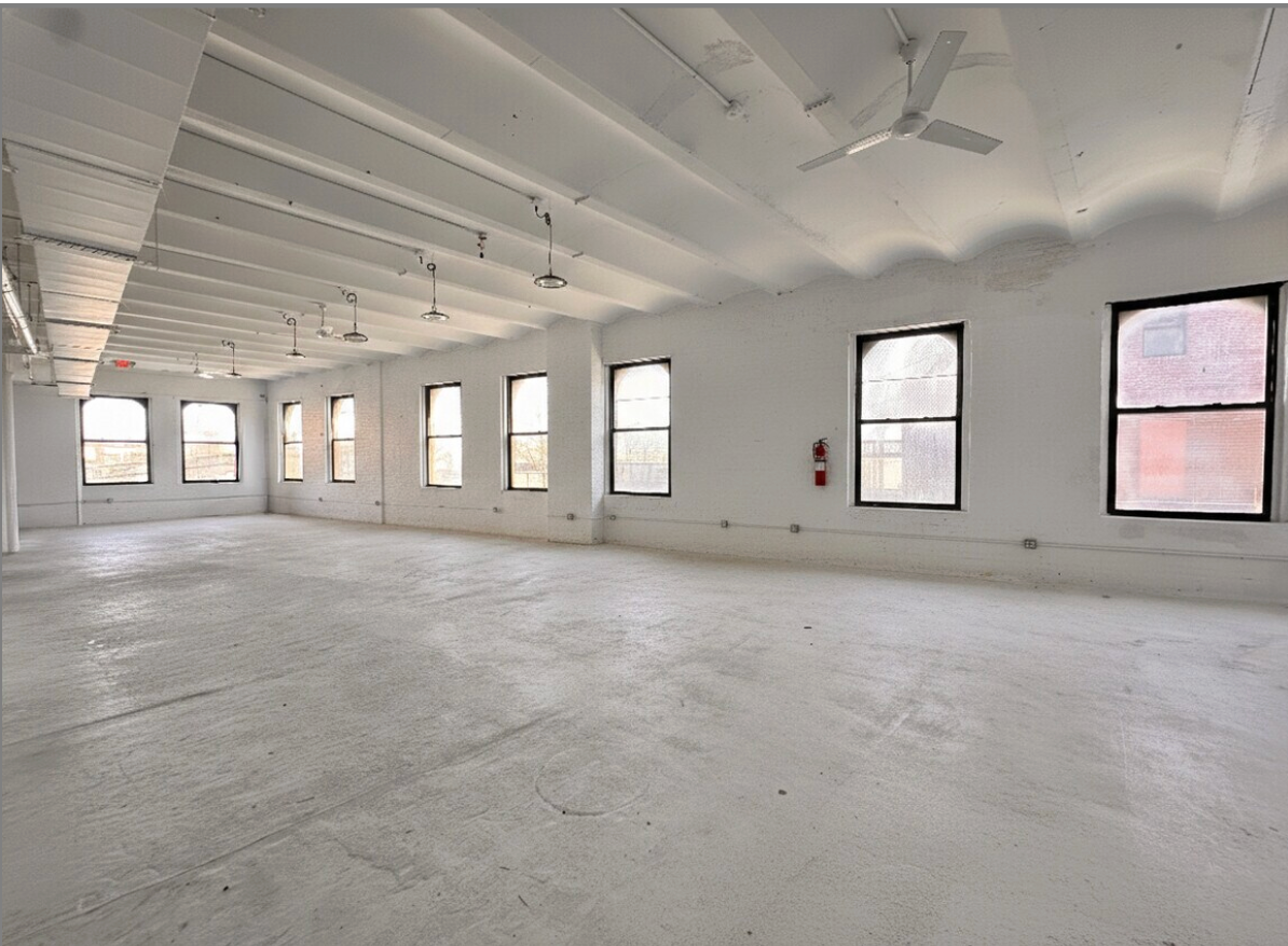 The bright, column-lined event space